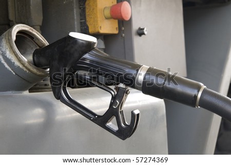 a truck refueling at a gas station before you travel