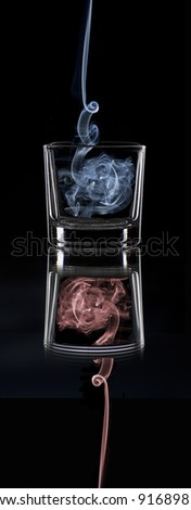 a smoke-filled glass in a mirror
