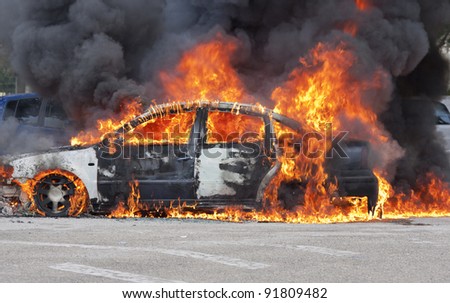 a burning car after a serious accident