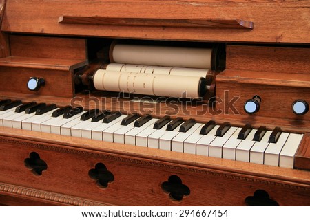 The old harpsichord with keyboard and notes.
