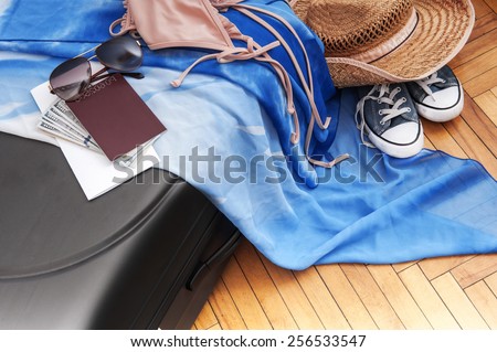 tourism background. Suitcase with things for the trip, money, tickets, passport