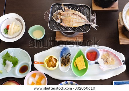 Typical Japanese breakfast: a cut-open and grilled horse mackerel or aji no hiraki.