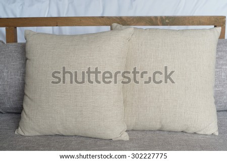 brown cushion pillows and cushion seats on outdoor wooden bench