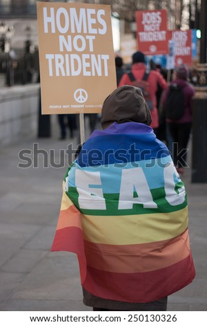 LONDON - JANUARY 24, 2015: Unidentified woman protests outside the Houses of Parliament against the proposed Â£100bn \