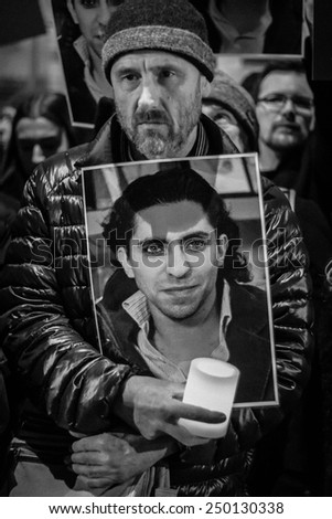 LONDON - JANUARY 17, 2015: Unidentified man at the Amnesty vigil for Saudi blogger, Raif Badawi, held outside the Royal Saudi Embassy.