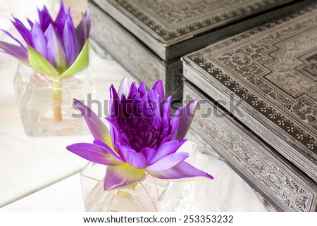 Lotus flower decoration with antique asian box in the mirror.