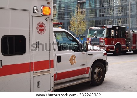CHICAGO, ILLINOIS/USA   OCTOBER 25, 2015: Chicago Fire Department ambulance and fire truck crews respond to incident on October 25, 2015 in West Loop.