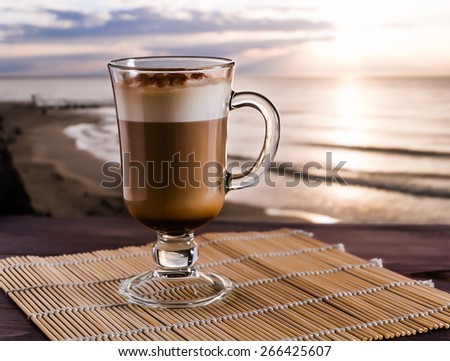 coffee latte on the sunrise background, selective focus