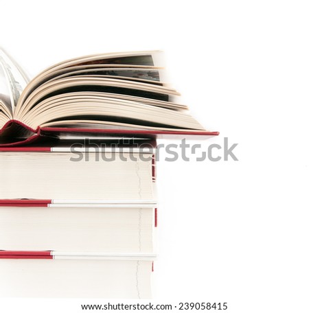 Open book on a pile of books with copy space for text