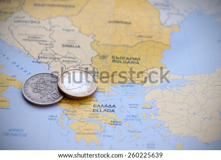 Euro coin and drachma  on a European map. Concept of Greek financial Crisis.