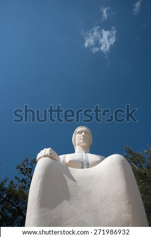 Famous landmark monument statue of the Cypriot mother or  mana  statue at  Palaichori village in Cyprus. The statue is situated at a hill above the village of Palaichori at Troodos mountain area.