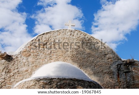 View of an old christian church in Cyprus against a blue cloudy sky