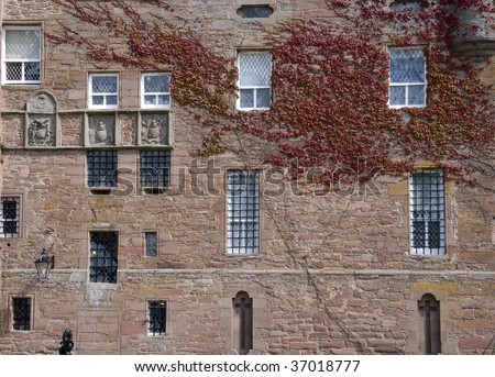 Castle stone  wall with windows and statues. Wall is from Glamis castle in Scotland