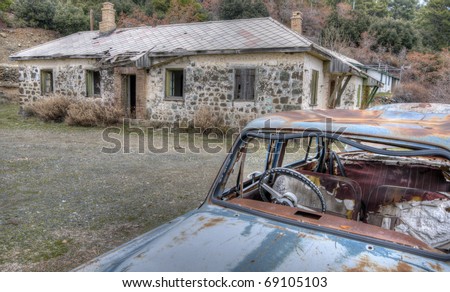 Abandoned place in Cyprus with scap car and a ruined house