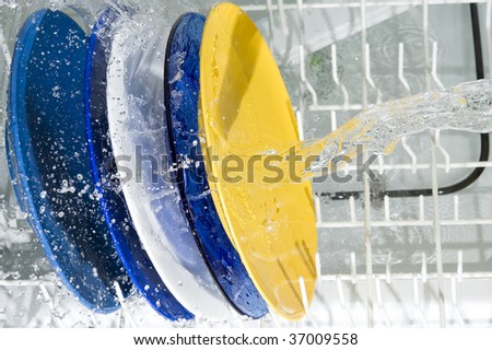 Dish-washing machine and plate. Splashing water