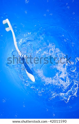 Toothbrush and splashing water. Health care