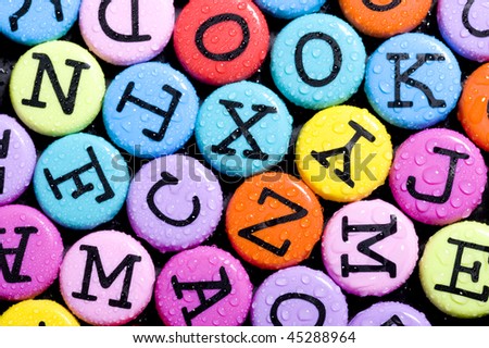 Alphabet colored background. Button with color letter
