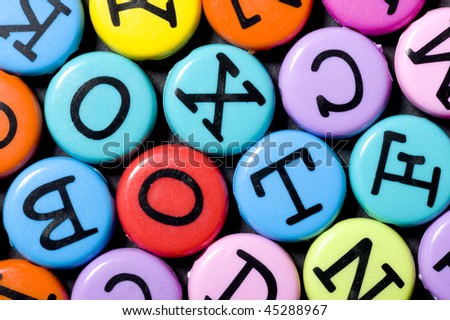 Alphabet colored background. Button with color letter