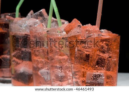 Red cocktail and ice. Cold de a alcoholic drink