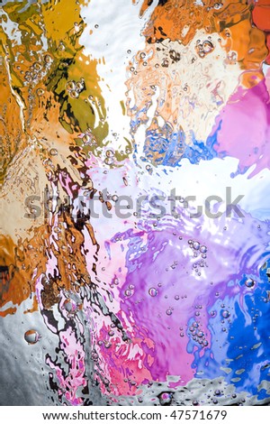 Background with colourful splashing  water. Creative abstract