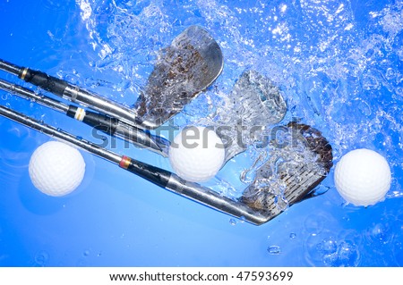 Golf club in blue water. Club with ball and bubbles