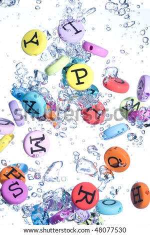 Alphabet colored background. Button with splashing water