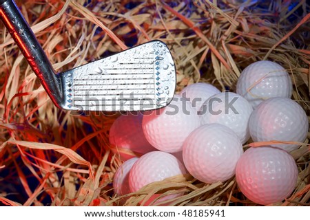 Golf club with  ball on dark background
