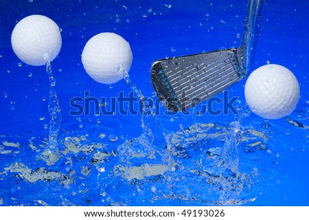 Golf club in blue water. Club with ball