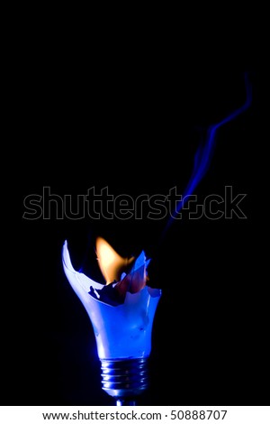 Broken light bulb with smoke on black background