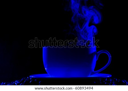 Coffee cup with steam on black background