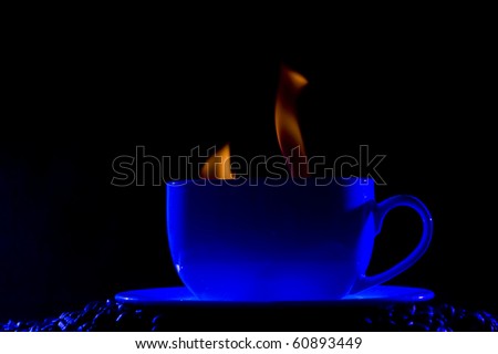 Coffee cup with steam on black background