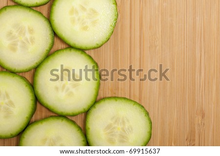 Vegetarian background with fresh green cucumber . Healthy vegetable