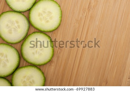 Vegetarian background with fresh green cucumber . Healthy vegetable