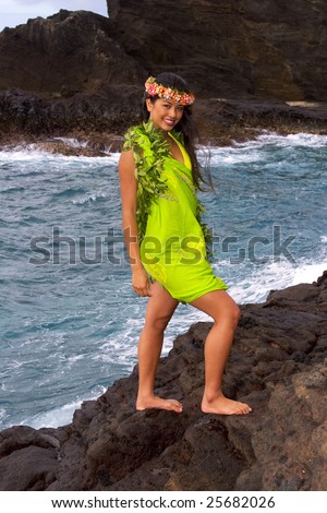 stock photo hawaiian girl with flowers on lava cliffs by the ocean in