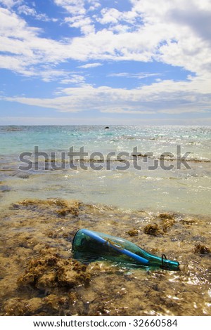 A glass bottle with a message inside floats to shore on a Pacific island