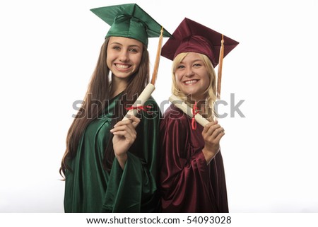 two female college graduates in cap and gown