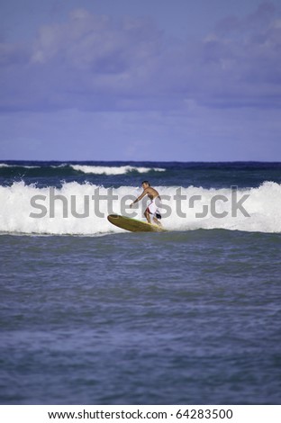 sixty-four year old man surfing in hawaii