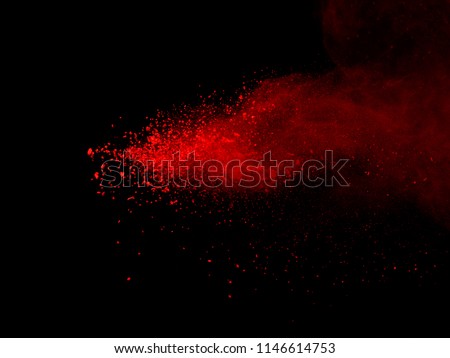 Abstract red dust explosion on black background. abstract red powder splatted on black background, Freeze motion of red powder exploding.