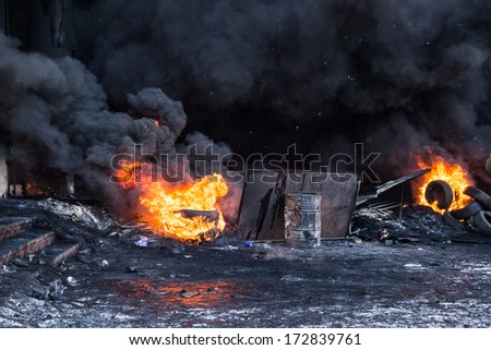 KYIV, UKRAINE - JAN 23: Fire in street during anti-government protest Euromaidan on January 23, 2014, in center of Kiev, Ukraine