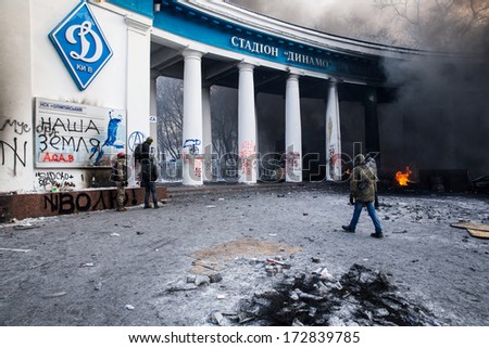KYIV, UKRAINE - JAN 23: Stadium Dynamo in smoke tubers during anti-government protest Euromaidan on January 23, 2014, in center of Kiev, Ukraine