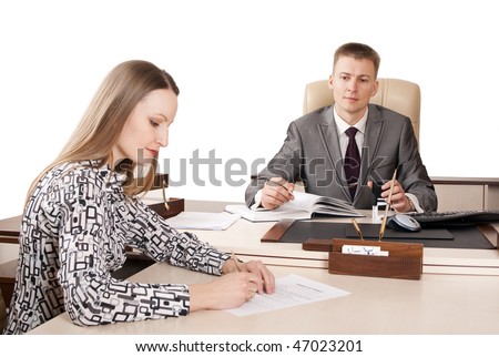 young woman signing a document in the office boss