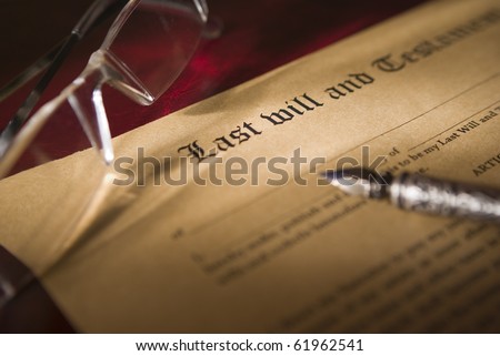 Antique quill and Old-fashioned paper with text of Last will