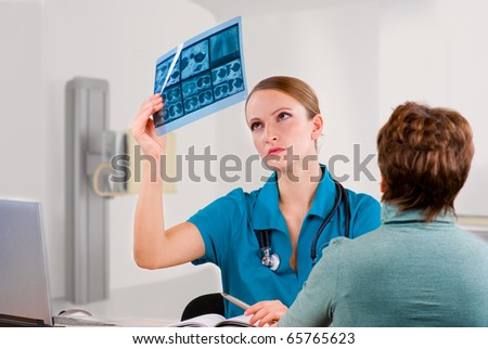 Doctor and patient discussing scan results in diagnostic center
