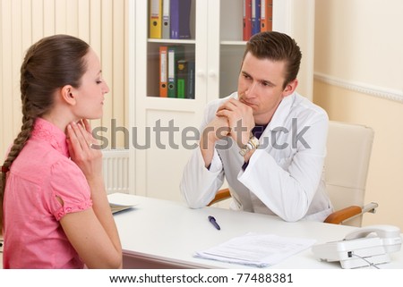 doctor talking with patient woman at doctors office
