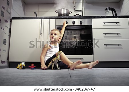accident prevention. The child unattended playing in the kitchen with a gas stove.