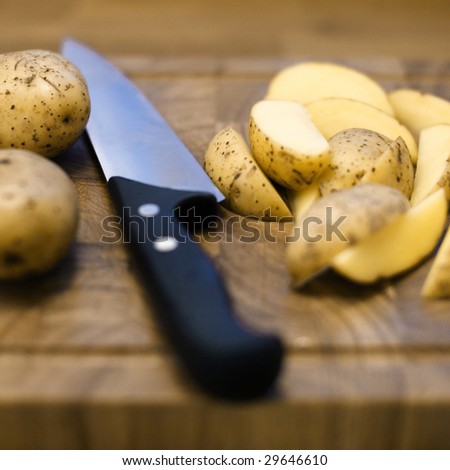 Food items and a knife on a cutting board