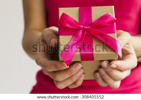 Young woman giving present