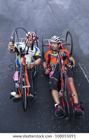 RIO DE JANEIRO - JULY 8: unidentified deficient physicists talk after cross  the arrival line in their tricycles in the Maratona do Rio. Event Maratona do Rio; July 8, 2012 at Rio de Janeiro, Brazil