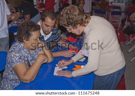 RIO DE JANEIRO - AUG 18: Origami workshop. People in the origame workshop learn how to do paper objects at the japanese party in Rio de Janeiro. August 18, 2012 in Rio de Janeiro, Brazil