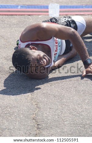 RIO DE JANEIRO - SEPT 09: unidentified Marathon runner feels bad at the event Maratona Pro Adidas 2012. September 09, 2012 in Rio de Janeiro, Brazil.